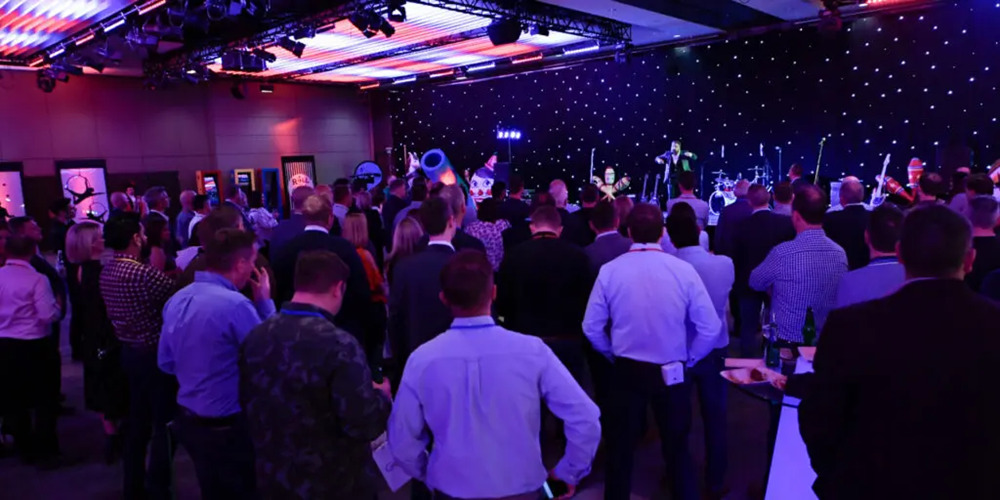 Making arrangements for artists and entertainment at dealer meetings and conferences